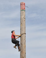 photo:  Timber Team climing a 45 foot pole